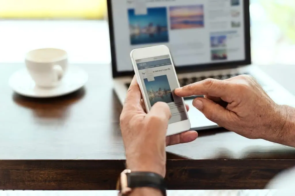 Elderly man visiting website on mobile phone